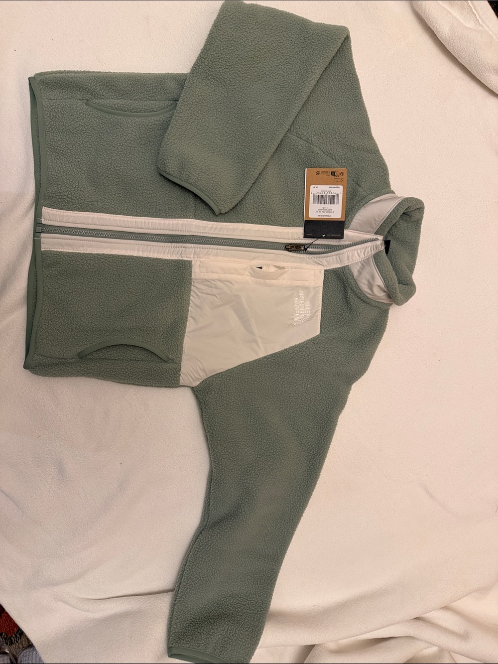 The North Face Kids Green Fleece Jacket with Cream Contrast Zip